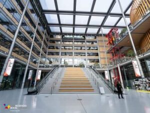 Foyer of the Drum conference space with central stair case and glass ceiling