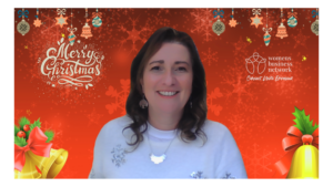 Image of Sharon Louca with a festive red christmas zoom background