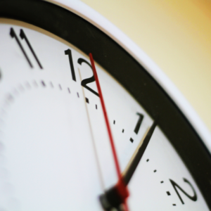 image of a clock face showing a small portion of the clock