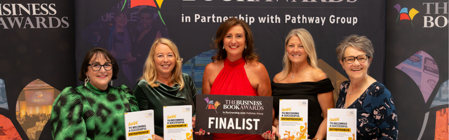 Picture of 5 members of WBN at the Business Book Awards holding a copy of their book and a Finalist banner