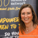 picture of Sharon Louca in an orange jumper
