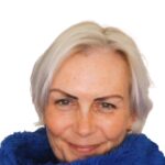 lady with short blond hair and blue jumper