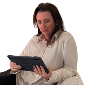 sharon sat looking down at a tablet